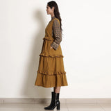 Left View of a Model wearing Golden Oak Tier Pinafore Frilled Dress