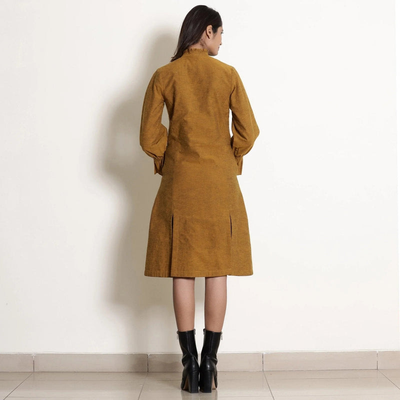 Back View of a Model wearing Golden Oak Warm Cotton Frilled Knee Length Dress