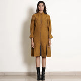 Front View of a Model wearing Golden Oak Warm Cotton Frilled Knee Length Dress