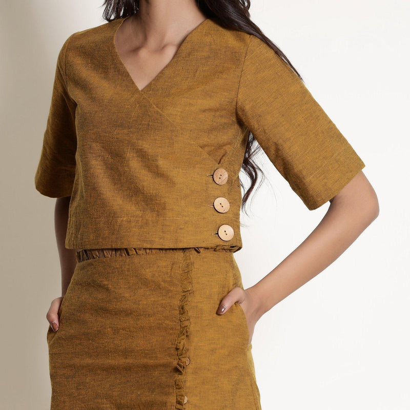 Front Detail of a Model wearing Golden Oak Warm V-Neck Wrap Top