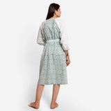 Back View of a Model wearing Green Block Print Cotton Peasant Midi Dress