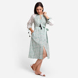 Right View of a Model wearing Green Block Print Cotton Peasant Midi Dress