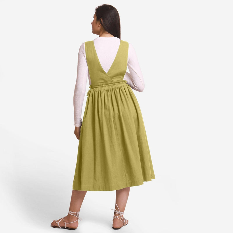 Back View of a Model wearing Green Deep Neck Pinafore Midi Wrap Dress