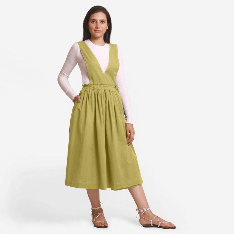 Front View of a Model wearing Green Deep Neck Pinafore Midi Wrap Dress