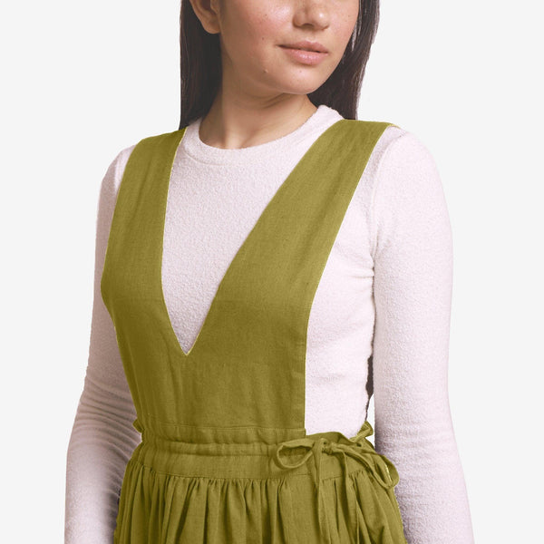 Front Detail of a Model wearing Green Deep Neck Pinafore Midi Wrap Dress