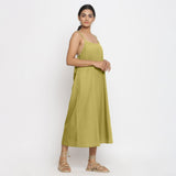 Right View of a Model wearing Green Cotton Flax Strap Sleeve A-Line Dress