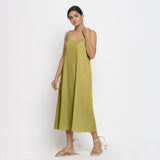 Left View of a Model wearing Green Cotton Flax Strap Sleeve A-Line Dress