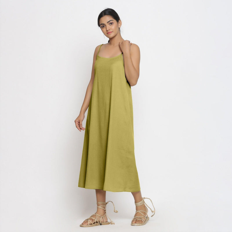 Left View of a Model wearing Green Cotton Flax Strap Sleeve A-Line Dress