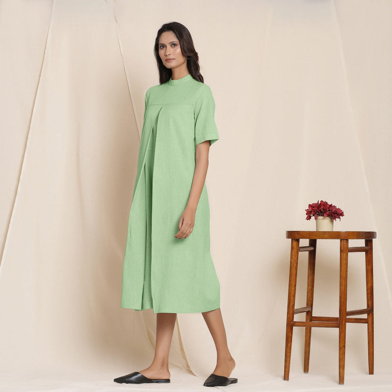 Left View of a Model wearing Cotton Green Box Pleated Jumpsuit