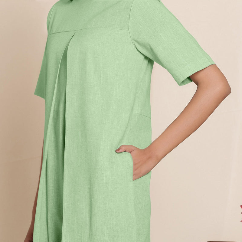 Front Detail of a Model wearing Cotton Green Box Pleated Jumpsuit