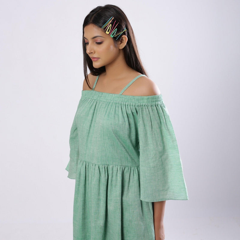 Left Detail of a Model wearing Green Off-Shoulder Fit and Flare Dress