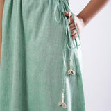 Left Detail of a Model wearing Green Handspun Strappy Circular Dress