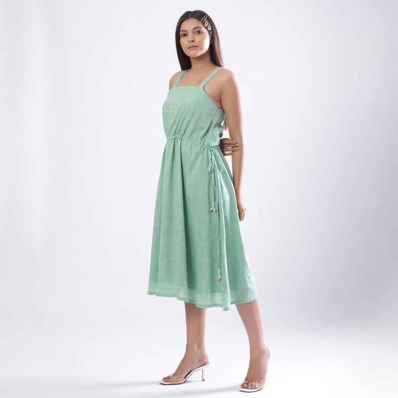 Left View of a Model wearing Green Handspun Strappy Circular Dress