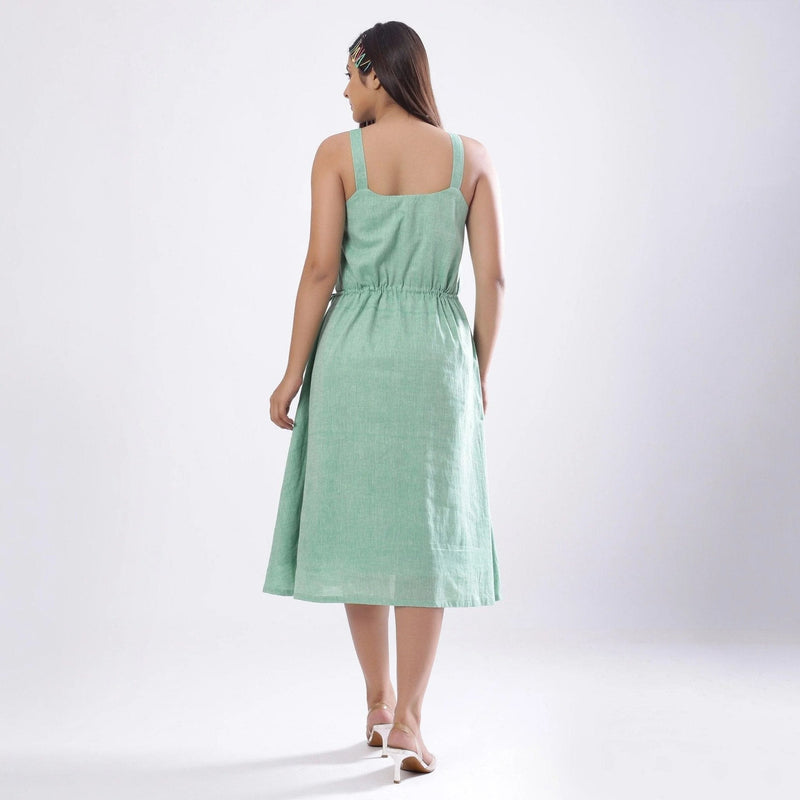 Back View of a Model wearing Green Handspun Strappy Circular Dress