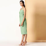 Left View of a Model wearing Green Cotton Sleeveless Button-Down Jumpsuit