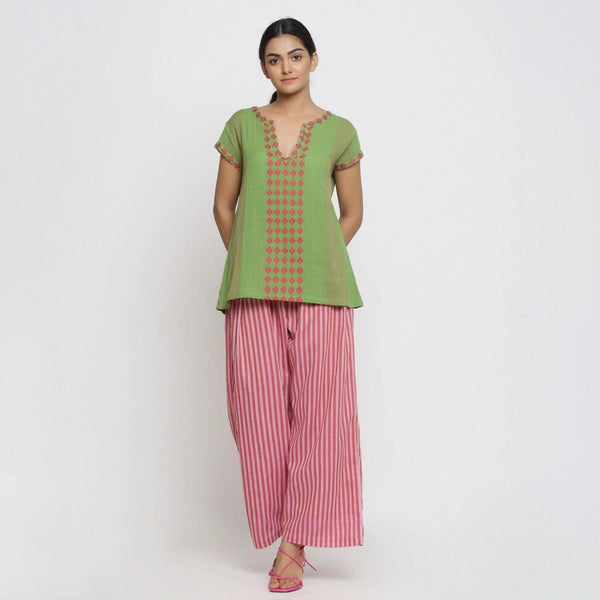 Front View of a Model wearing Green And Red Yarn Dyed A-Line Top