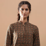 Front View of a Model wearing Muddy Green Kalamkari Warm Shirt