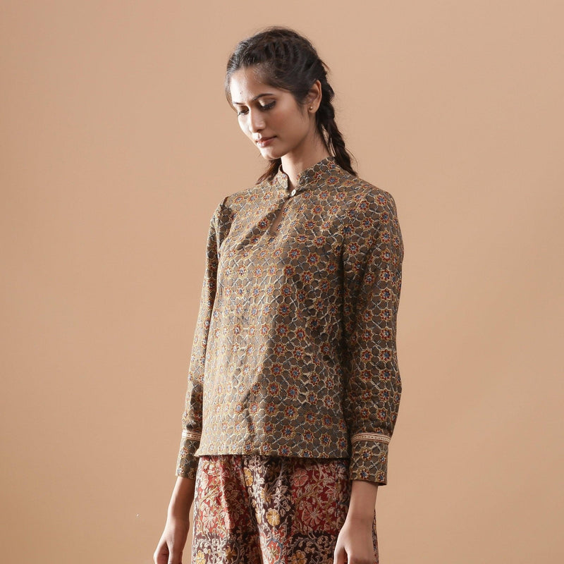 Left View of a Model wearing Muddy Green Kalamkari Warm Shirt