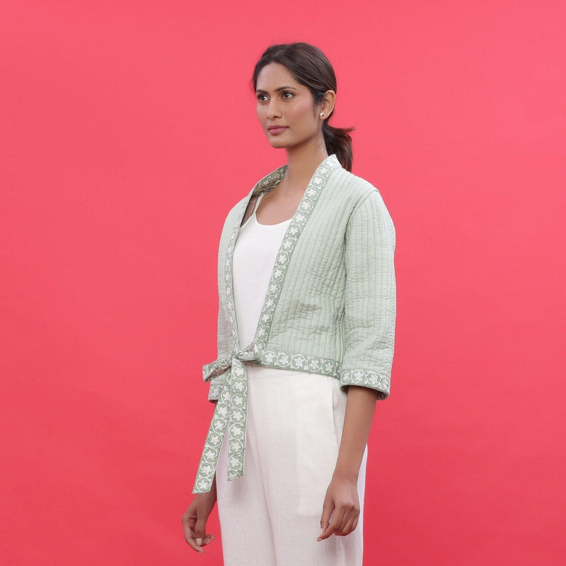 Left View of a Model wearing Green Reversible Quilted Cotton Shrug