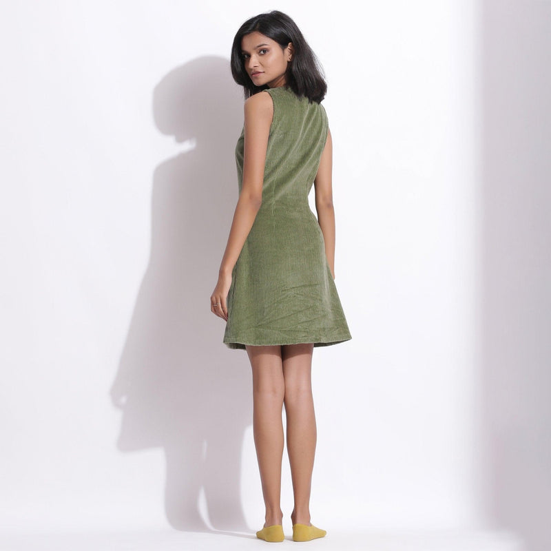 Back View of a Model wearing Green Warm Cotton Corduroy Sleeveless Short Dress