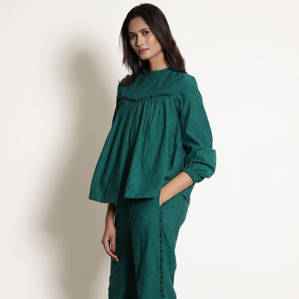 Left View of a Model wearing Warm Green Frilled Gathered Yoked Top