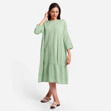 Front View of a Model wearing Green Yarn-Dyed 100% Cotton Tier Midi Dress