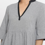 Front Detail of a Model wearing Solid Grey Yarn Dyed Cotton Peplum Top