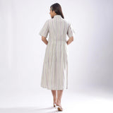 Back View of a Model wearing Handspun Cotton Muslin Button-Down Shirt Dress