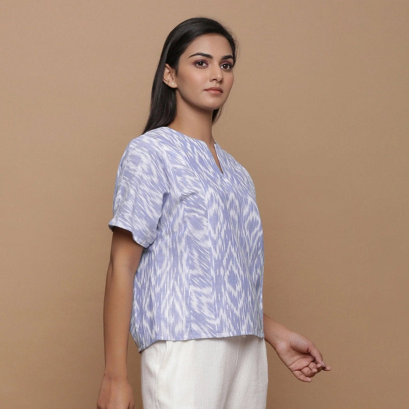 Right View of a Model wearing Ikat Powder Blue Split Neck Top