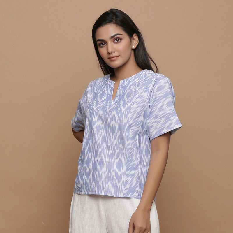 Front View of a Model wearing Ikat Powder Blue Split Neck Top