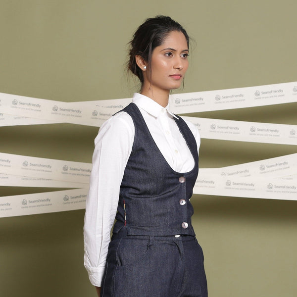 Right View of a Model wearing Indigo Cotton Denim Slim Fit Vest