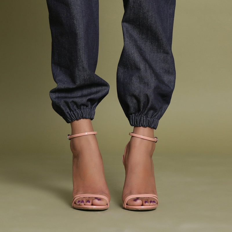 Close View of a Model wearing Indigo Cotton Denim Elasticated Mid-Rise Jogger Pant