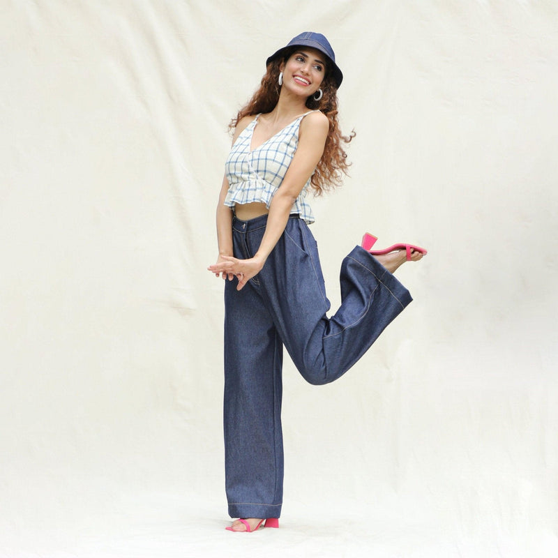 Left View of a Model wearing Indigo Cotton Denim High-Rise Elasticated Wide Legged Pant