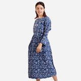 Left View of a Model wearing Indigo Dabu Block Print A-Line Floral Dress