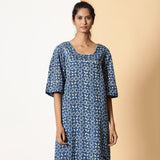 Front View of a Model wearing Breezy Cotton Indigo Dabu Maxi Tier Dress