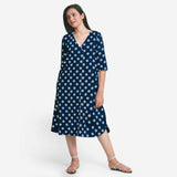 Front View of a Model wearing Indigo Polka Dot Plunge Neck Dress