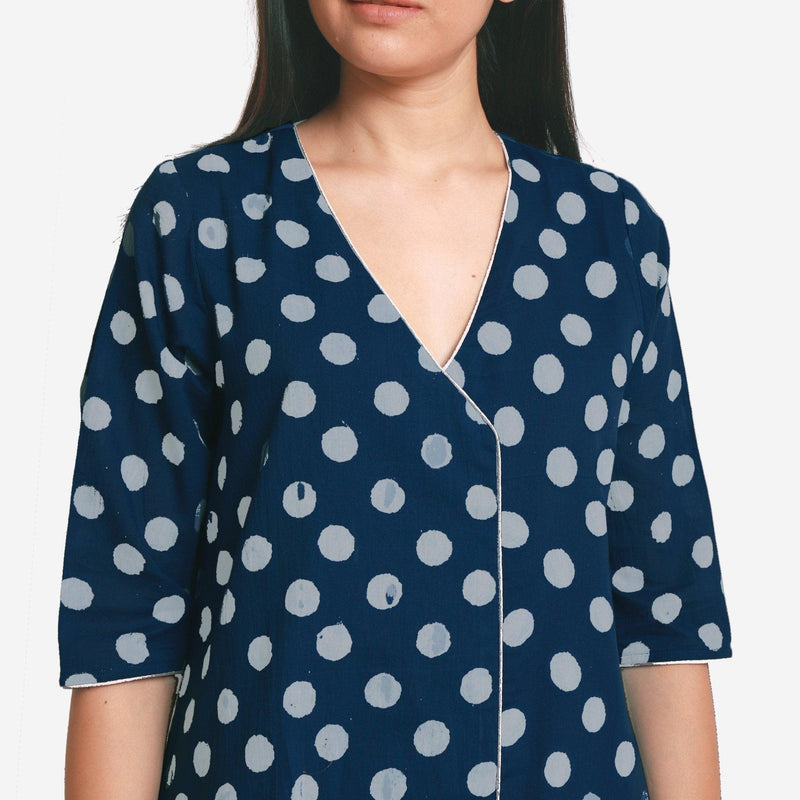 Front Detail of a Model wearing Indigo Polka Dot Plunge Neck Dress