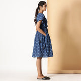 Right View of a Model wearing Indigo Dabu Block Printed Polka Dot Frilled Dress