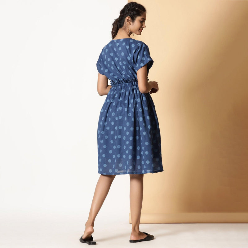 Back View of a Model wearing Indigo Dabu Block Printed Polka Dot Frilled Dress