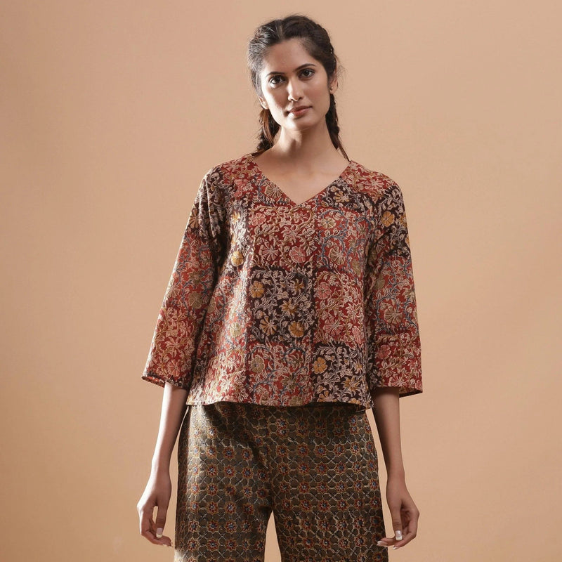 Front View of a Model wearing Muddy Red Kalamkari Raglan Sleeves Top