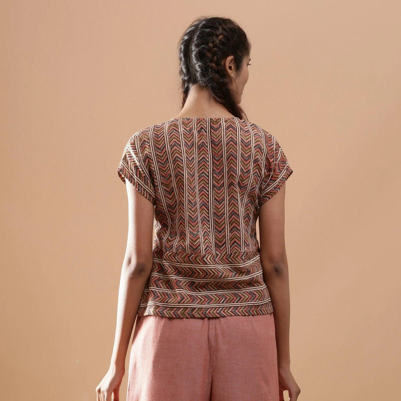 Back View of a Model wearing Kalamkari Cotton Chevron Yoked Top