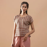 Front View of a Model wearing Kalamkari Cotton Chevron Yoked Top