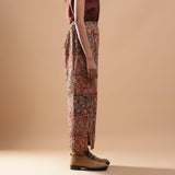 Right View of a Model wearing Muddy Red Wide-Leg Kalamkari Slit Pant