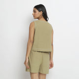 Back View of a Model wearing Crisp Khaki Green Top and Handspun Shorts Set