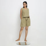 Front View of a Model wearing Crisp Khaki Green Top and Handspun Shorts Set