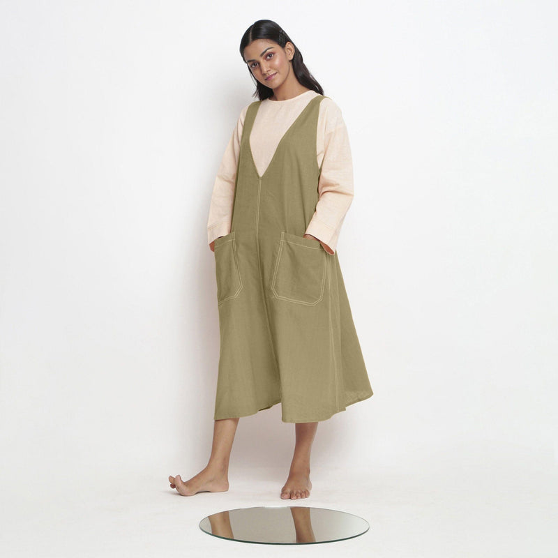 Left View of a Model wearing Khadi Green Handspun Cotton Deep Neck Shift Dress