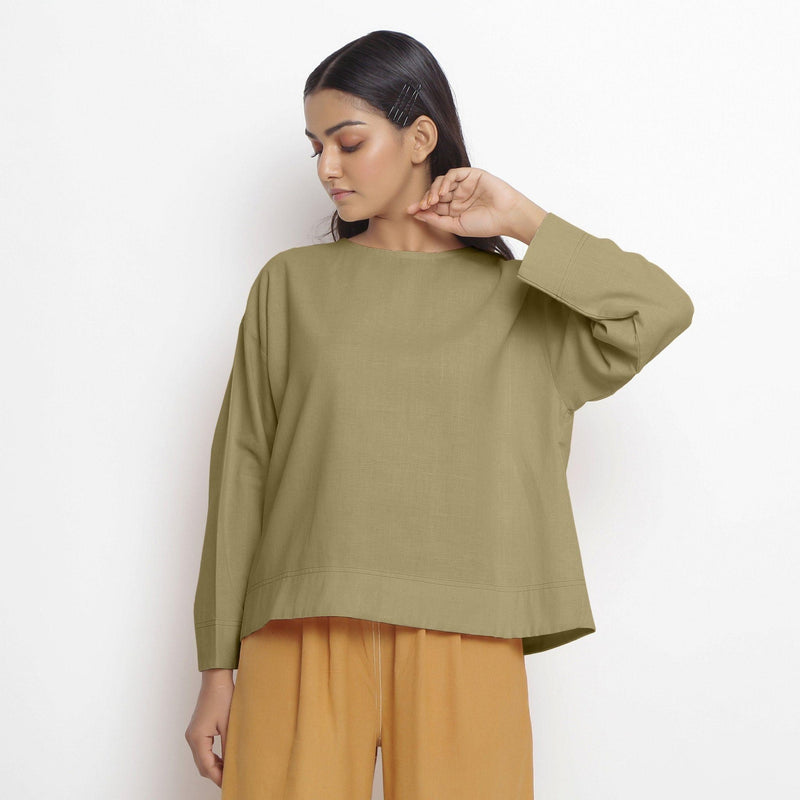 Front View of a Model wearing Vegetable-Dyed Green 100% Cotton Straight Top