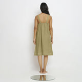 Back View of a Model wearing Green Vegetable Dyed Handspun Slip Dress