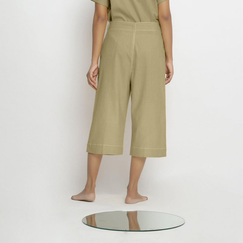 Back View of a Model wearing Mid-Rise Green Vegetable Dyed Cotton Culottes