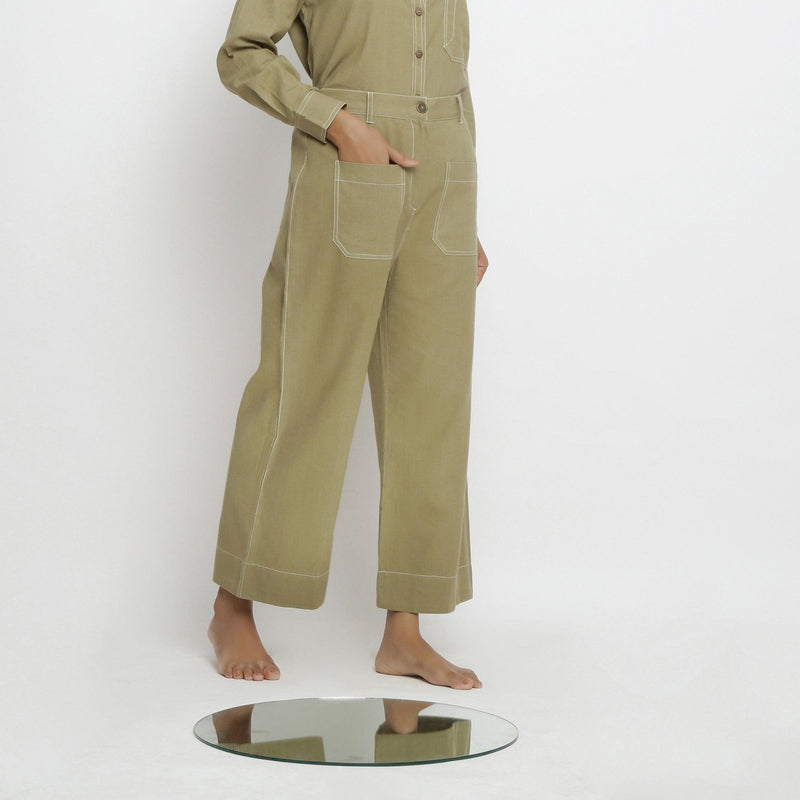 Right View of a Model wearing Khaki Green Vegetable Dyed Handspun Cotton Patch Pocket Wide Legged Pant